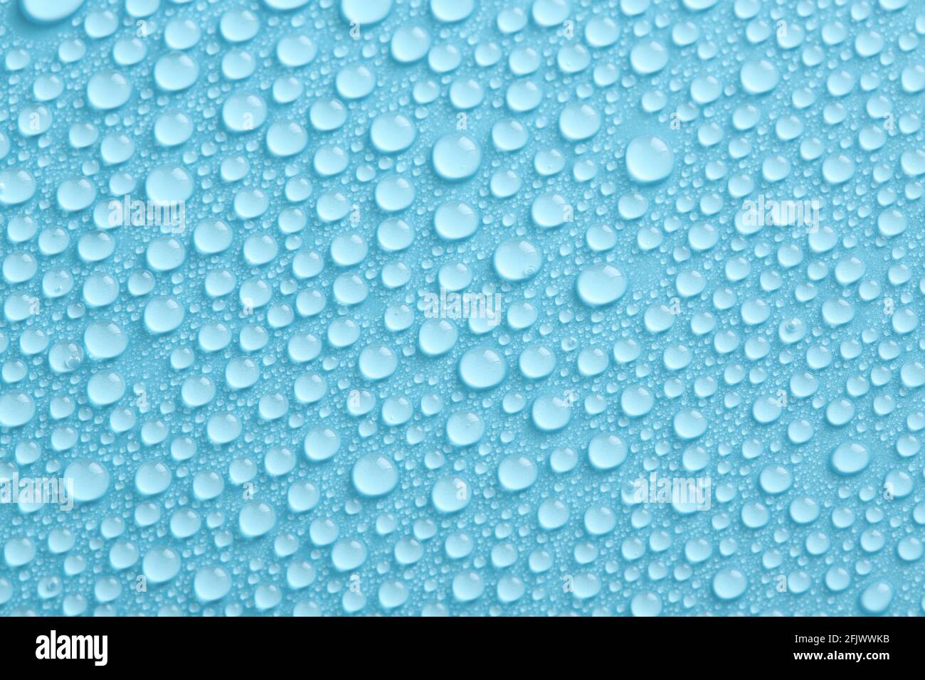 Water drops texture on blue background. Abstract background with pure droplets pattern. Stock Photo