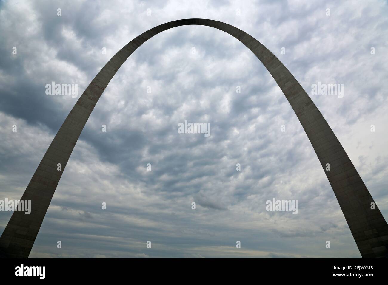 Silhouette of Gateway Arch on cloudy sky - St Louis, Missouri Stock Photo