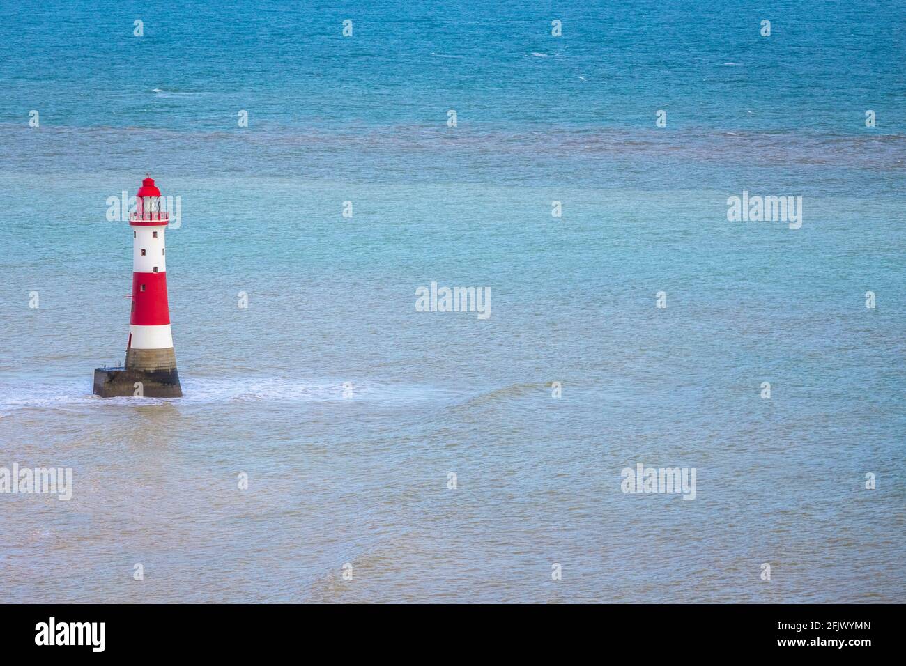 View of Beachy Head lighthouse in the sea. Eastbourne, East Sussex, Southern England. Stock Photo