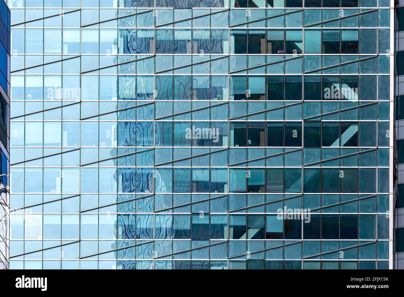 Times Square Tower, 7 Times Square, is known for its visible structural bracing and for the electronic billboards that surround the base. Stock Photo