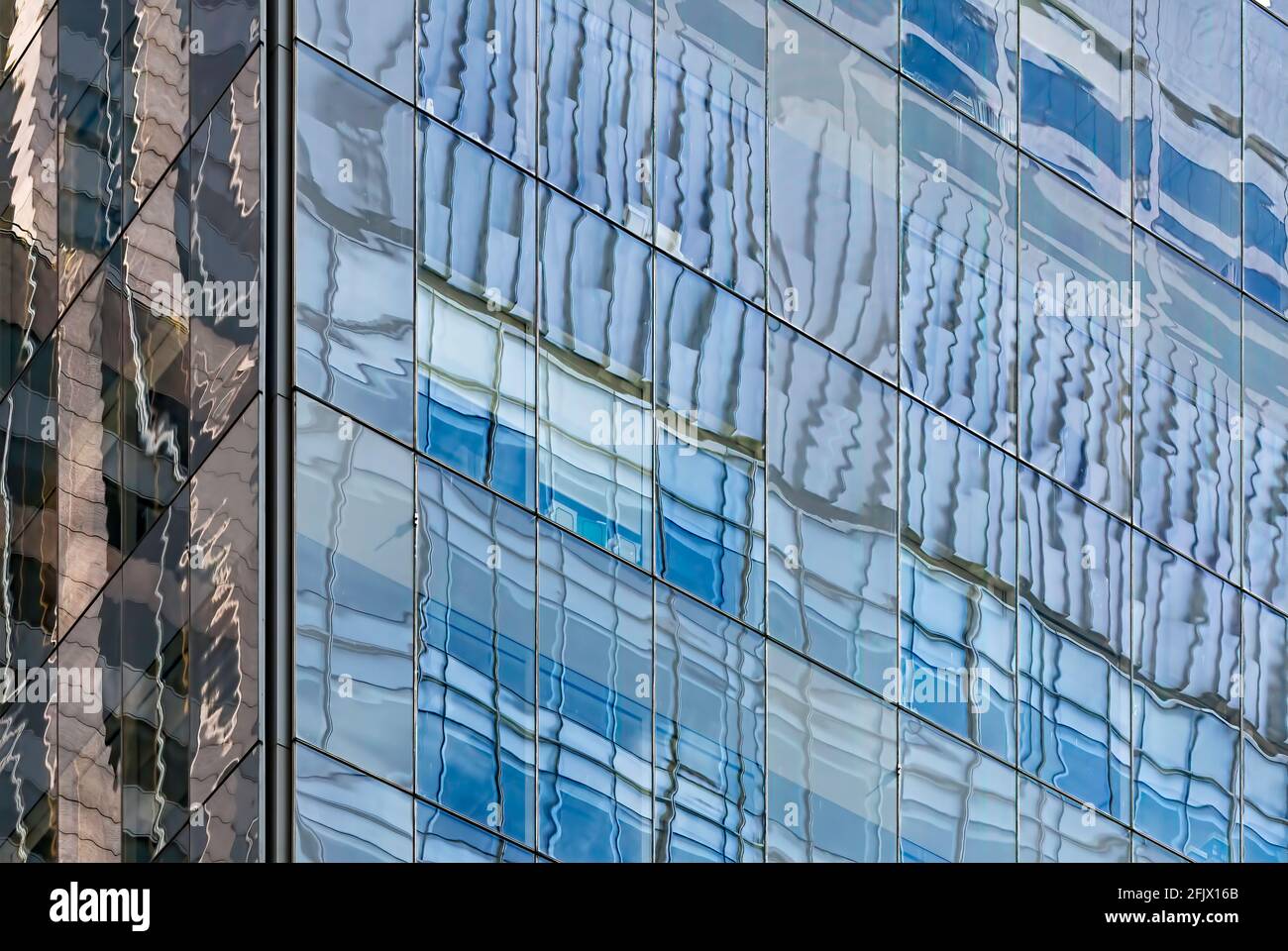 Reflective glass and steel grids in New York City office skyscrapers. Stock Photo