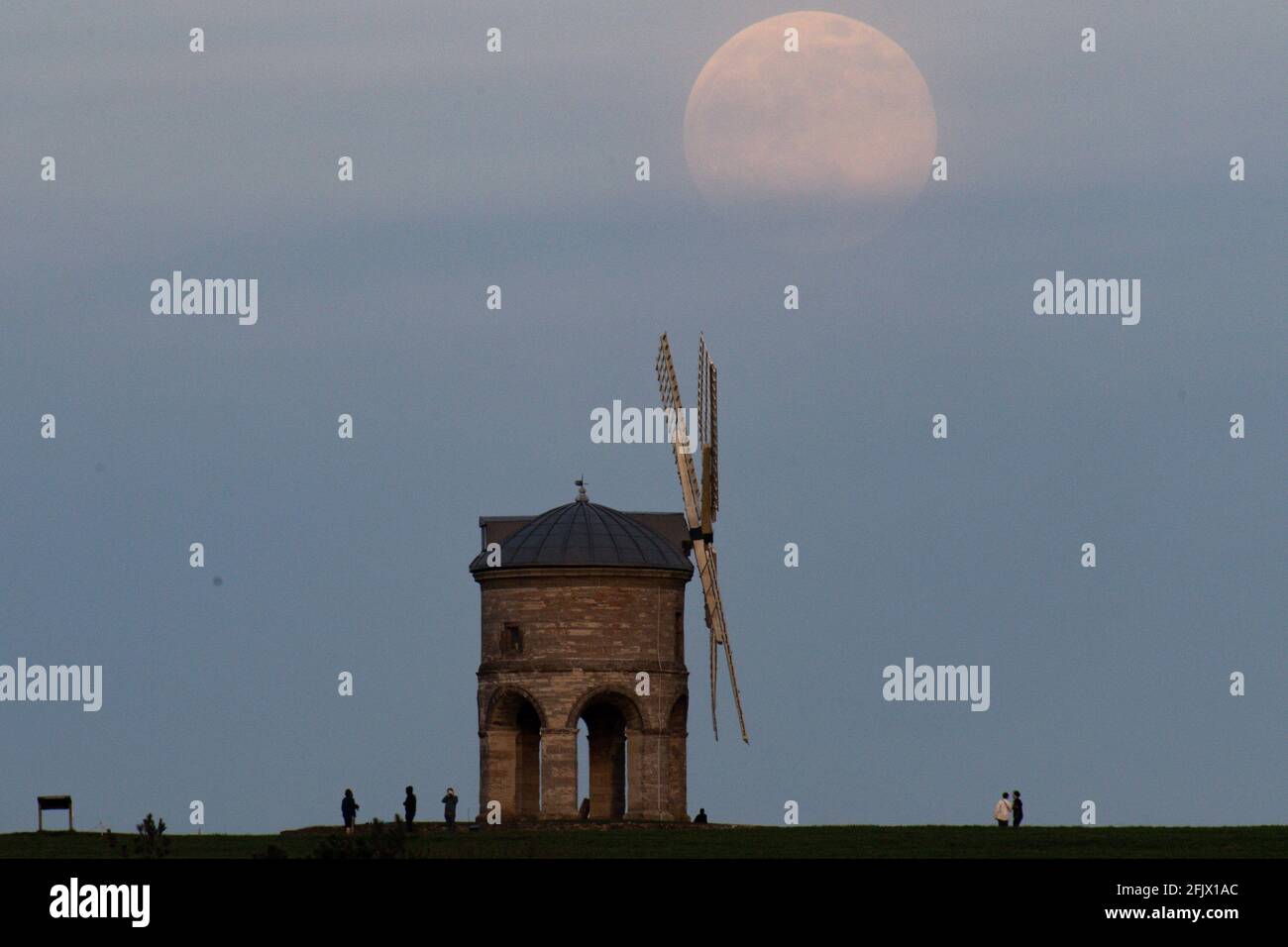 The moon rises behind Chesterton Windmill in Warwickshire, before the April super full moon on the 27th, which is traditionally known as the Pink Moon. Picture date: Monday April 26, 2021. Stock Photo