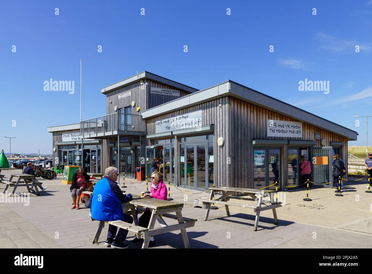 Rhyl north Wales cycle hub and cafe people sat eating at tables in the