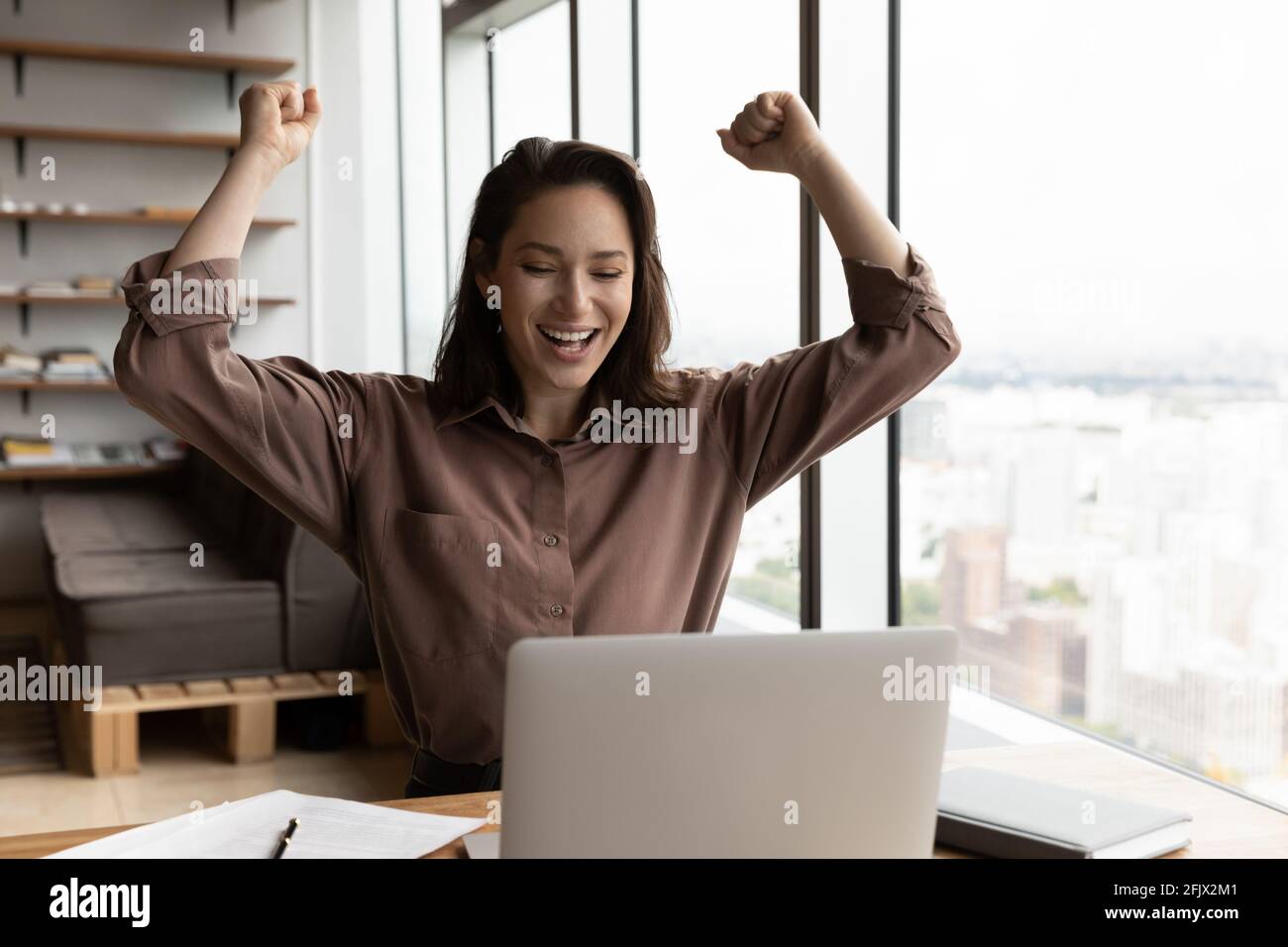 Woman excited laptop hi-res stock photography and images - Alamy