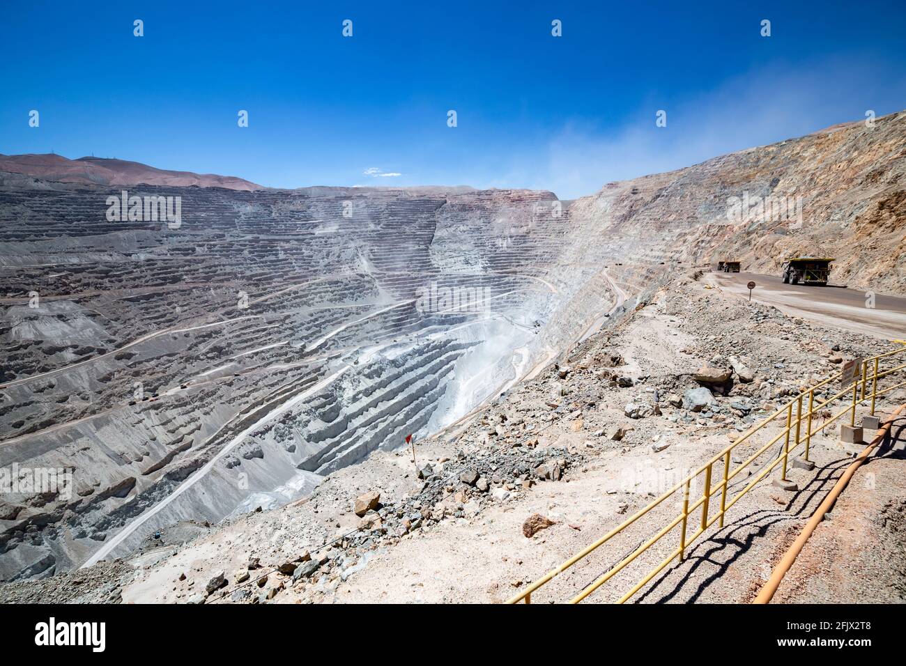 Big haul truck and machinery working in Chuquicamata, biggest open pit copper mine of the world, Calama, Chile Stock Photo
