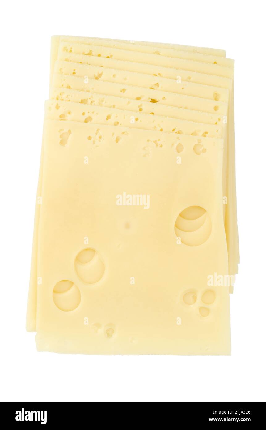 Emmental cheese, sandwich slices, from above. Sliced processed Emmentaler, also Emmenthal, a yellow, medium-hard cheese with holes. Stock Photo