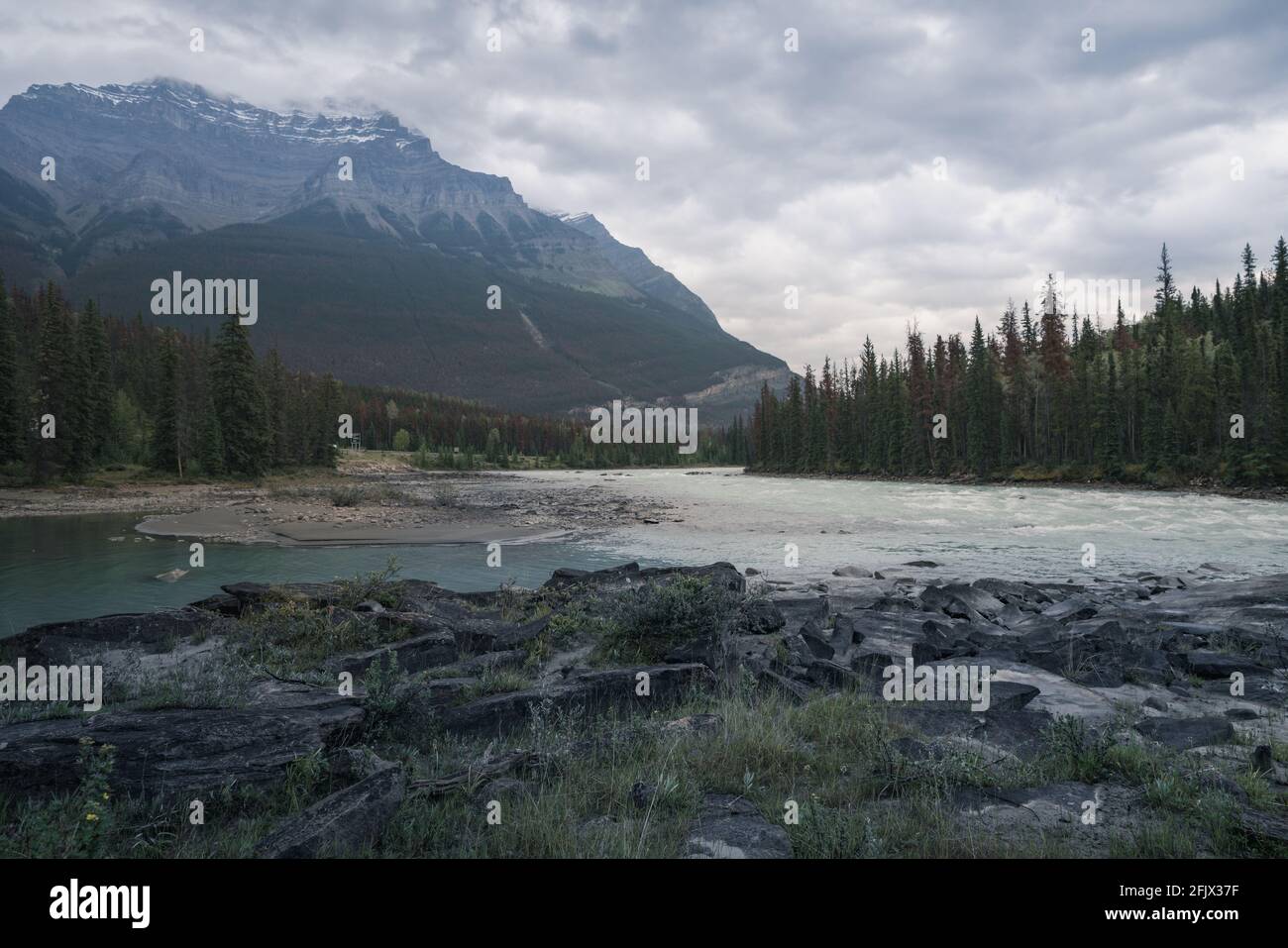 Extremely cloudy and rainy weather above Athabasca River and Mount