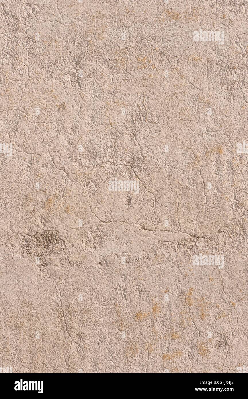 Old and cracked stone wall Stock Photo