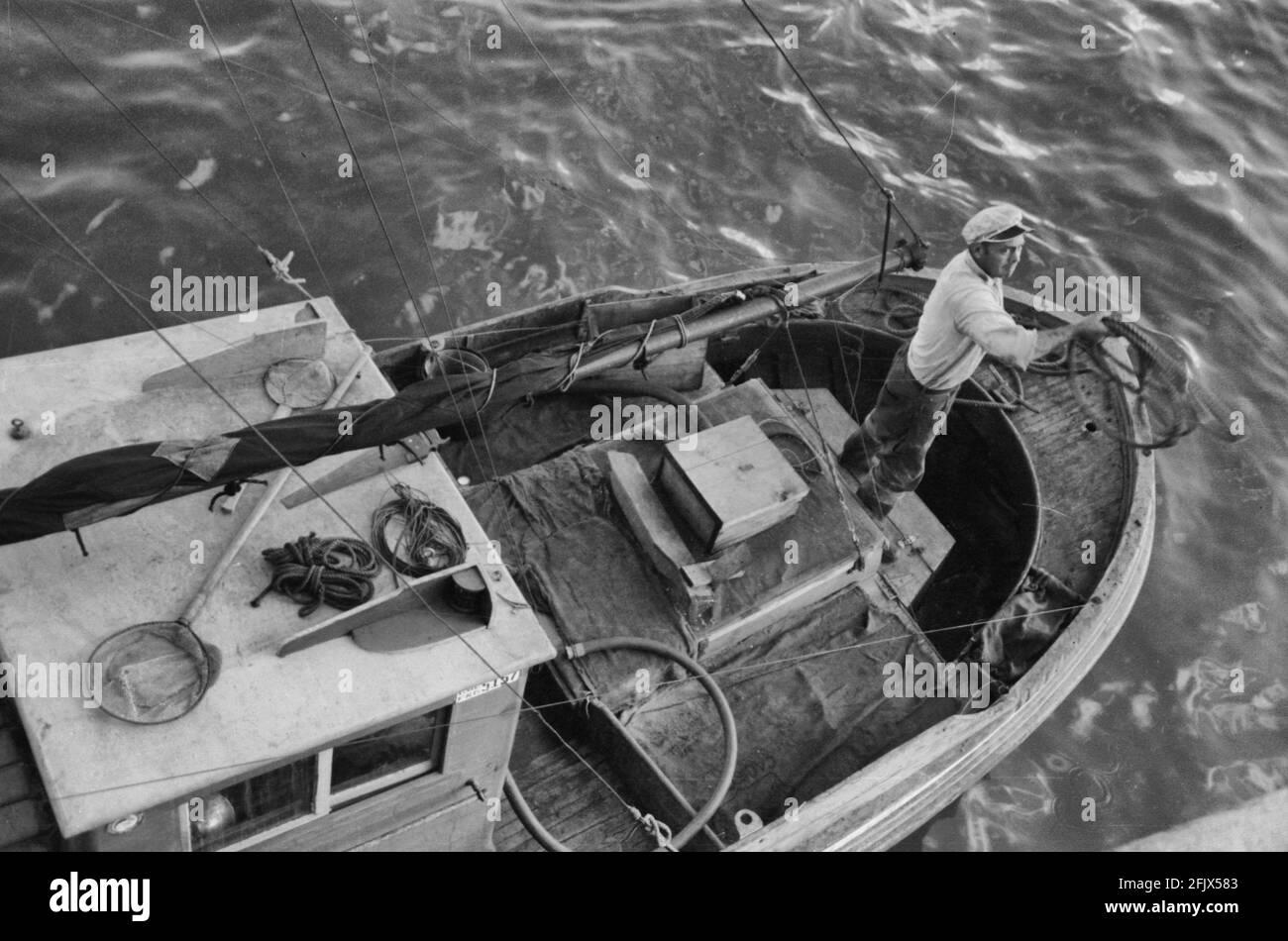 Throwing line ashore from fishing boat at the docks of the Columbia