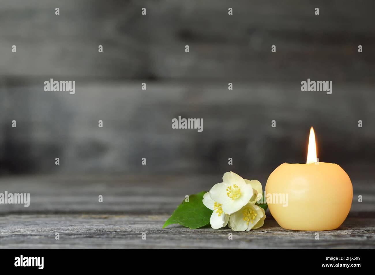 Candle and flower. Condolence card Stock Photo