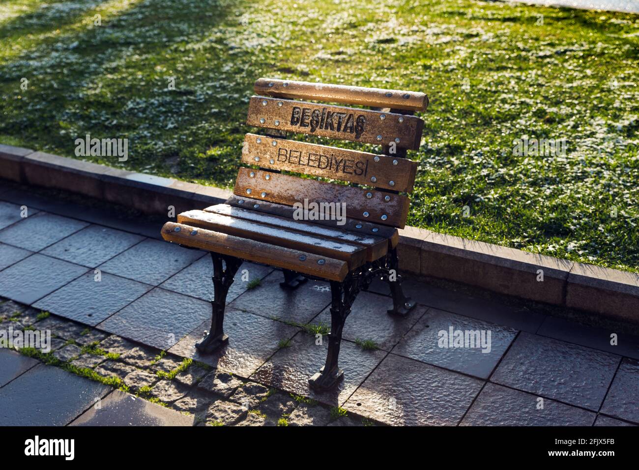 Levent, Istanbul, Turkey - January 28th, 2021: Single person, modified wooden bench belonging to the Besiktas Municipality of Istanbul, to provide a f Stock Photo