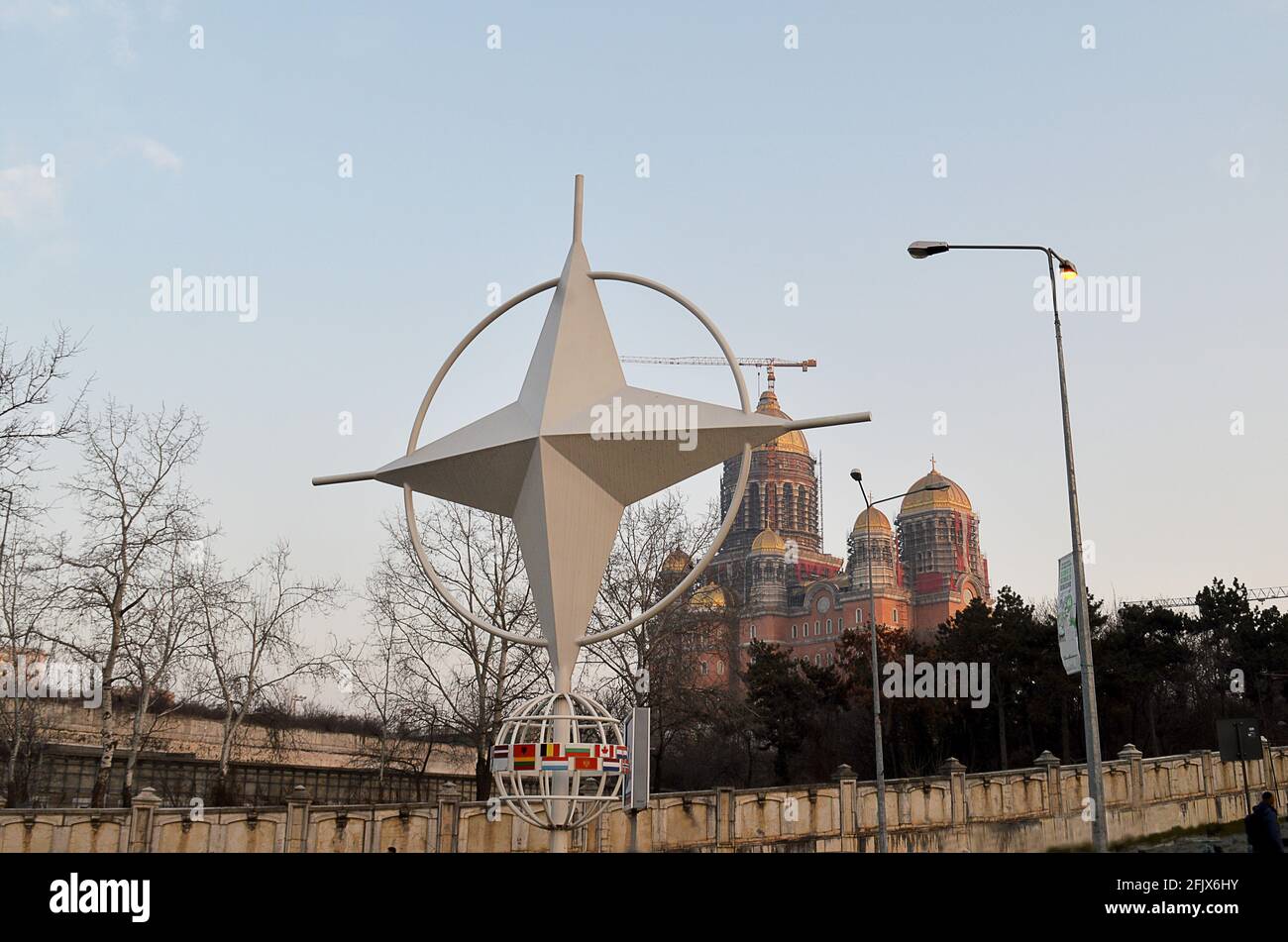 BUCHAREST, ROMANIA - 24  FEBRUARY 2021: The NATO compass star in Bucharest in front of the Catedrala Mântuirii Neamului (Cathedral of the People's Sal Stock Photo