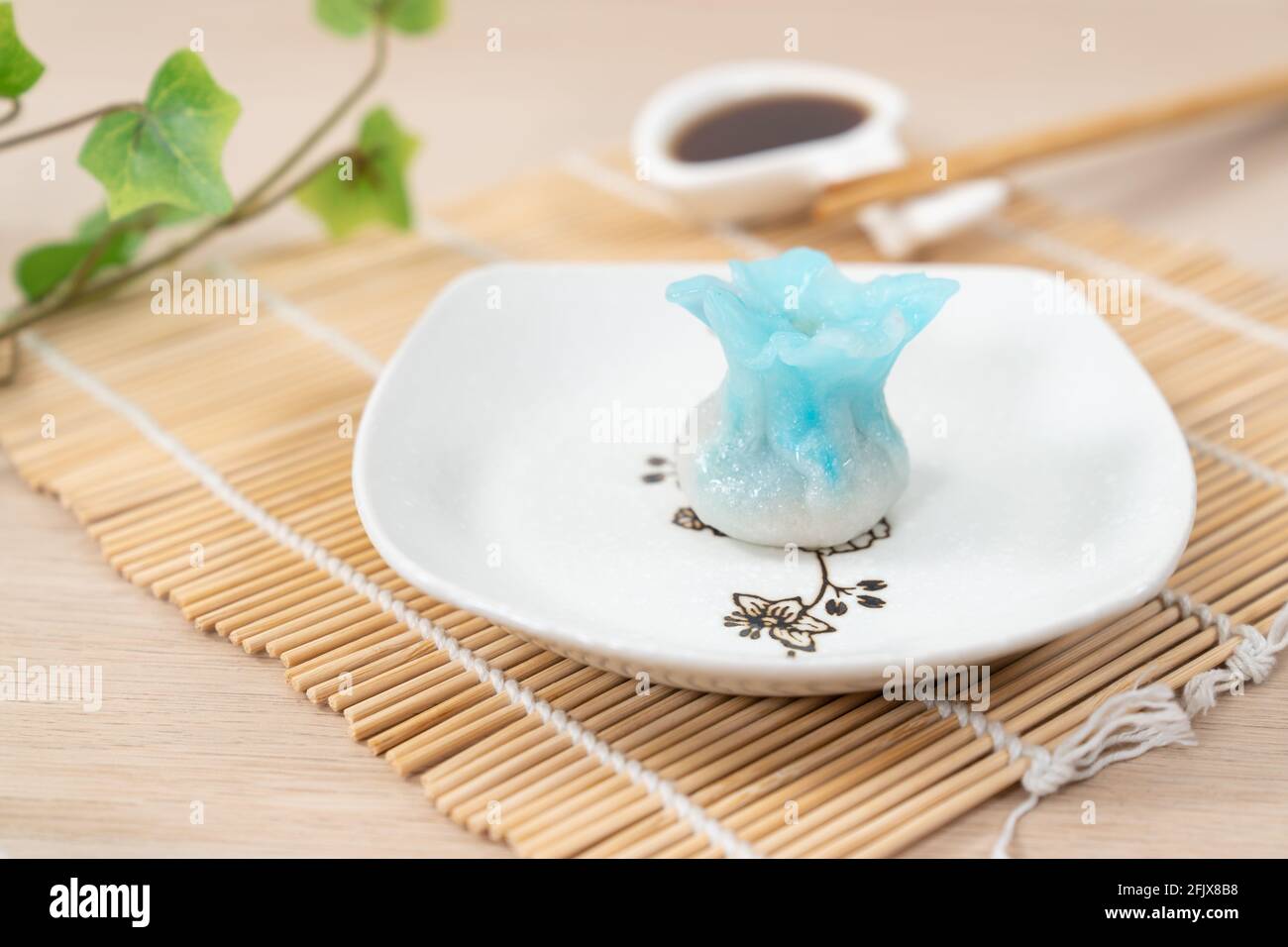 Chinese blue color flower dumpling or dim sum Stock Photo - Alamy