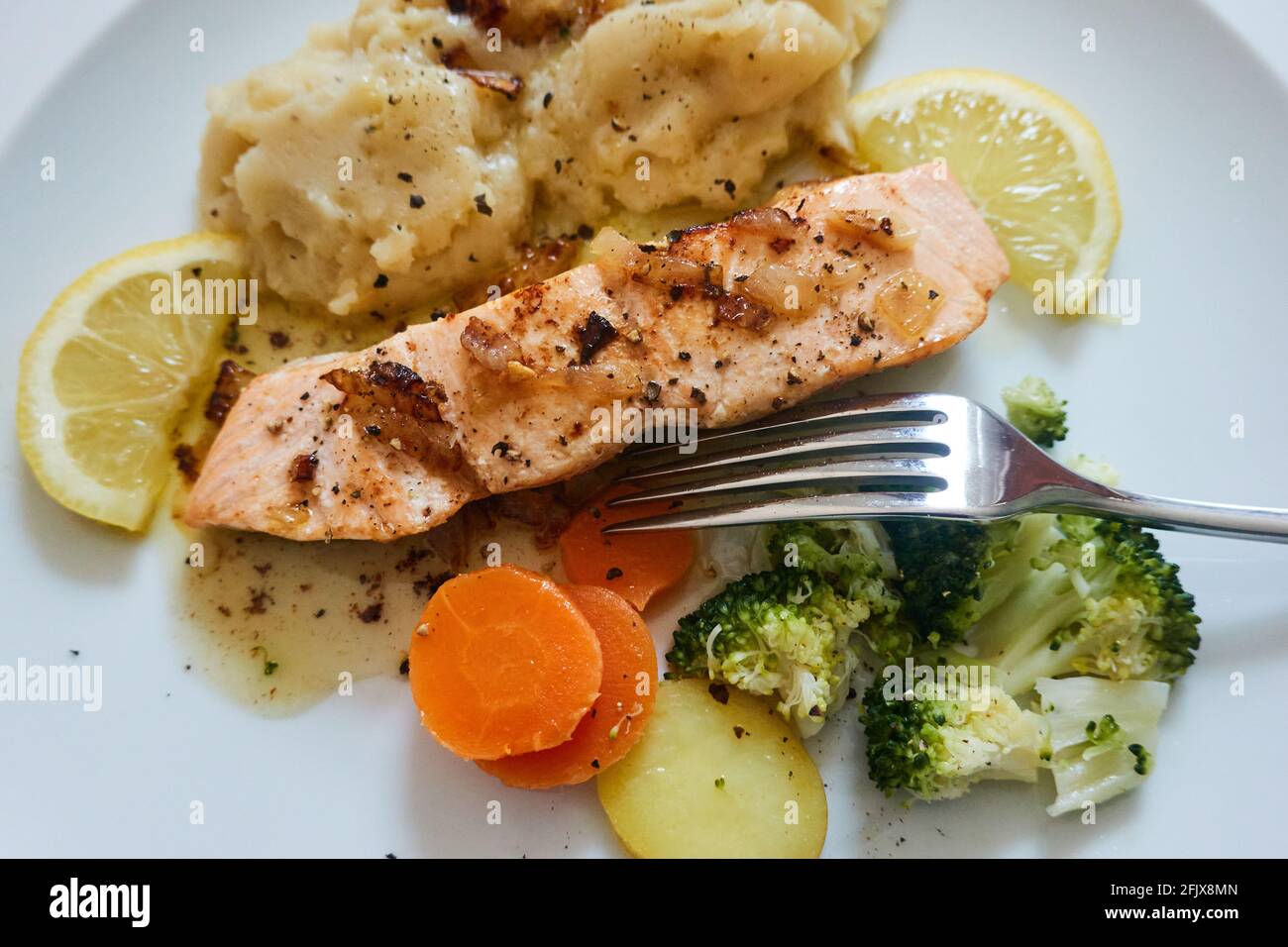 Sautéed salmon with vegetables Stock Photo