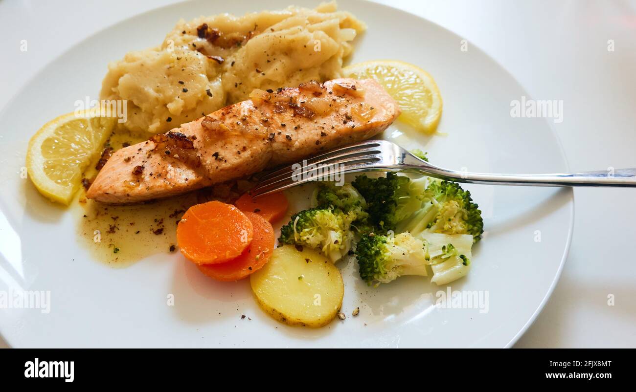 Sautéed salmon with vegetables Stock Photo