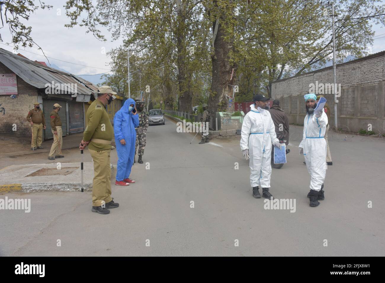Srinagar, Jammu and kashmir India 07 August 2020. Brave men covid heroes sanitizing srinagar city. Wearing kits and taking safty measures are in sop d Stock Photo