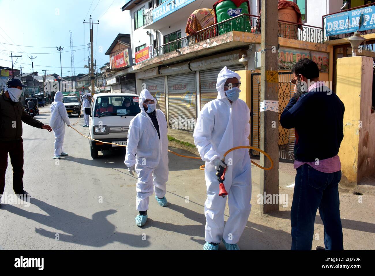 Srinagar, Jammu and kashmir India 07 August 2020. Kit wearing frontline warriors sanitizing streets houses and parts of srinagar city. SMC Srinagar is Stock Photo
