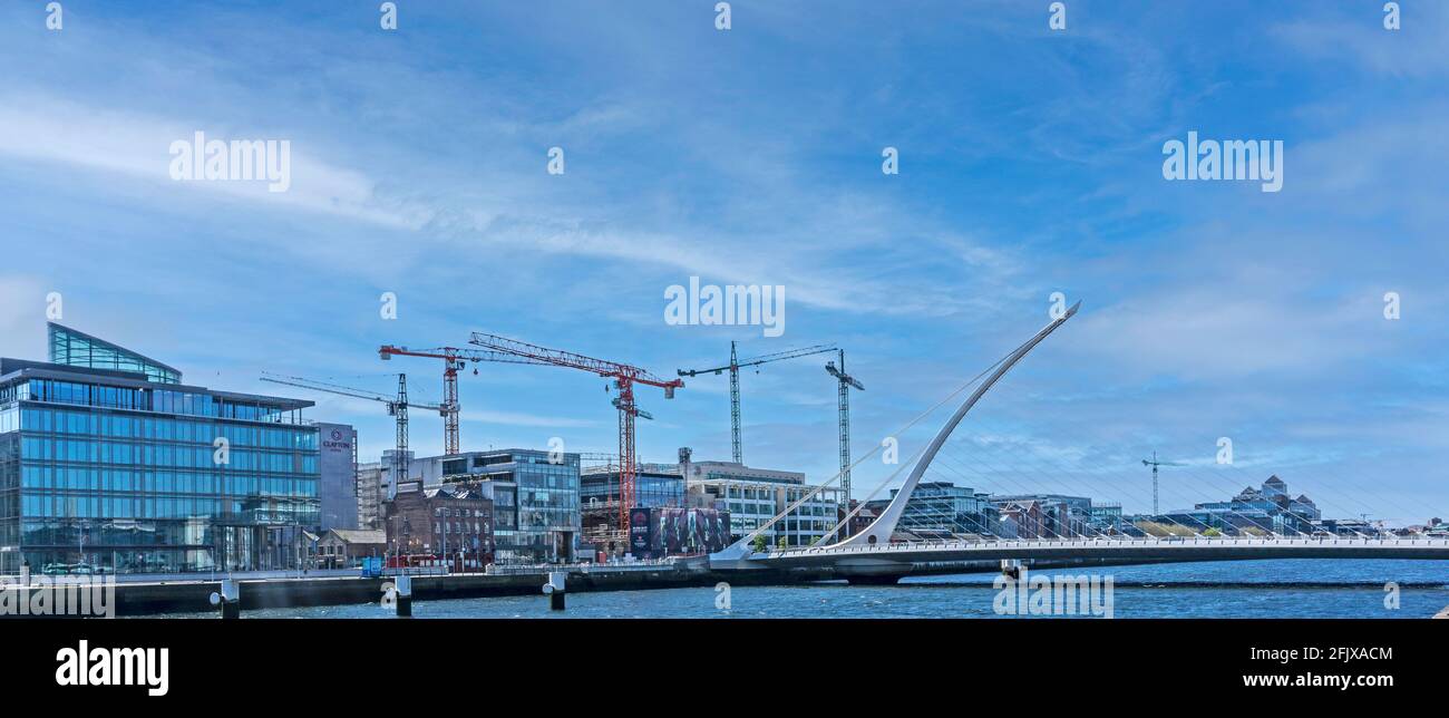 Cranes on the South Quays in Dublin, Ireland, beside the Samuel Beckett Bridge, Stock Photo