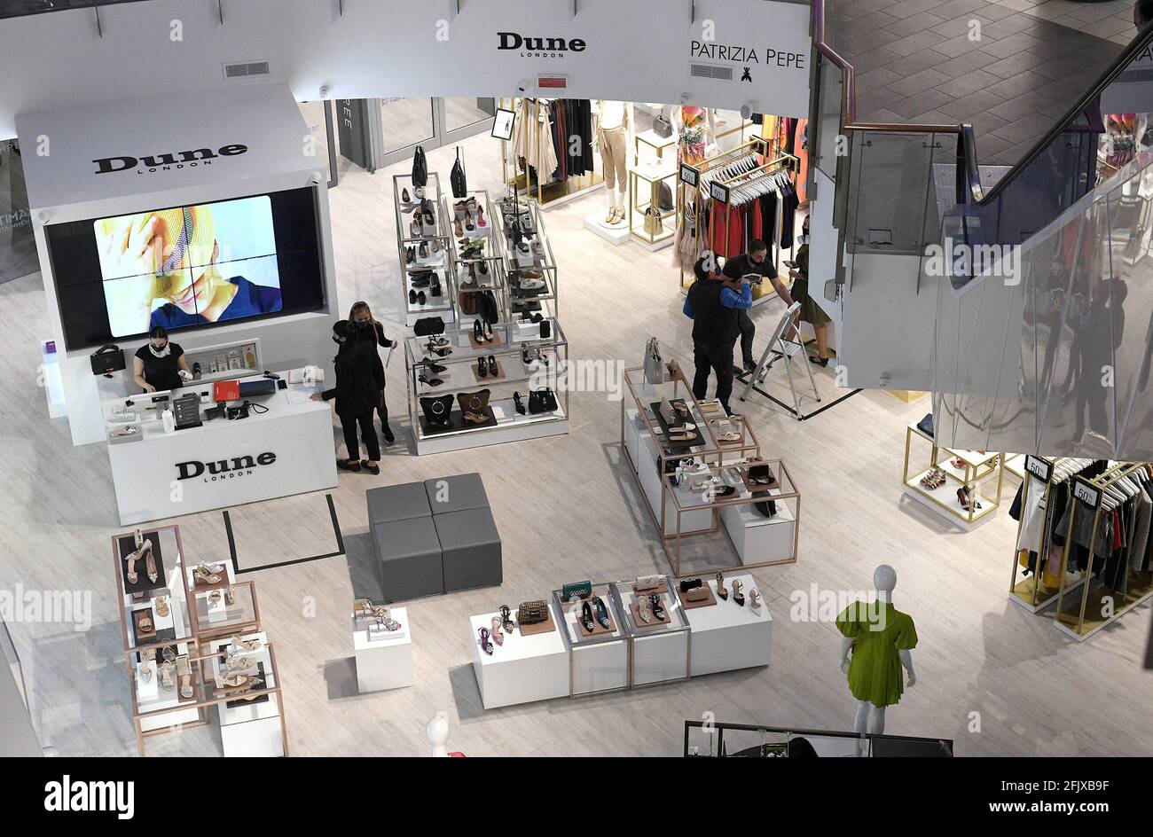 Sliema, Malta. 26th Apr, 2021. People are seen in a reopened store in