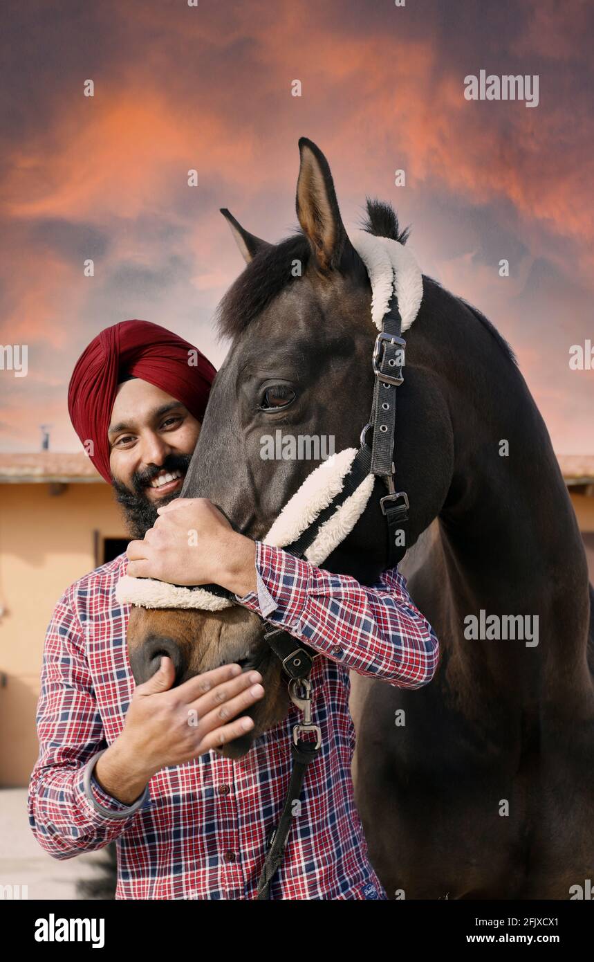 rider with his horse embraced smiling Stock Photo