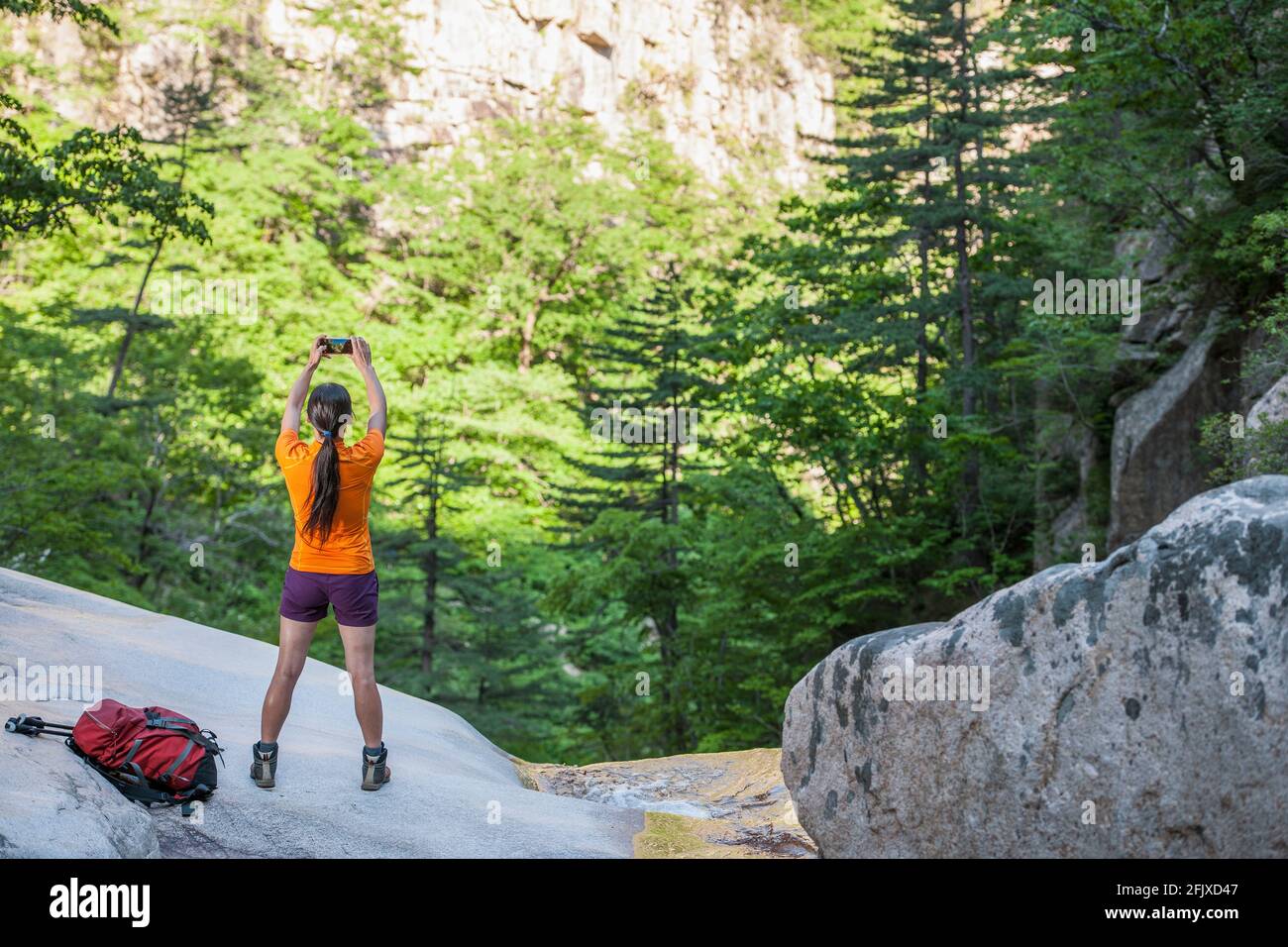 Female hiker taking picture at Seoraksan national park / Korea Stock Photo