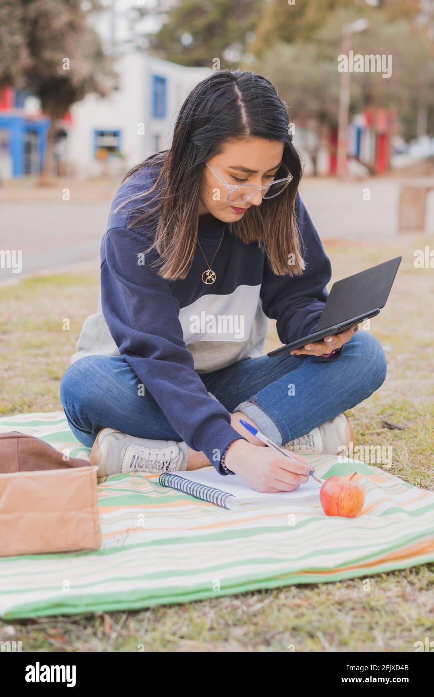 Young college girl studying in the park Stock Photo - Alamy