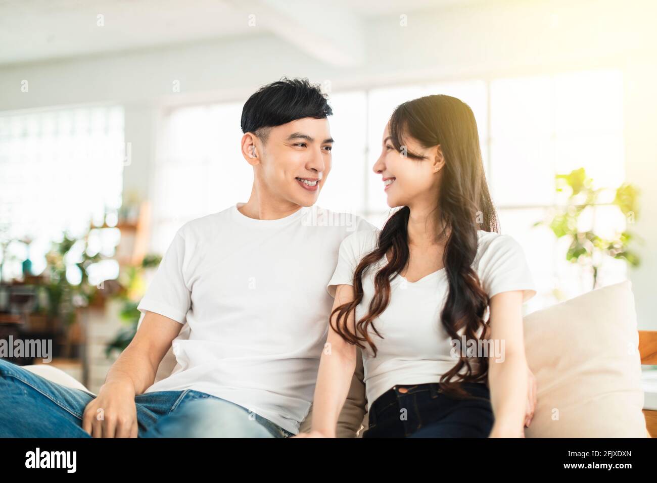 Happy young  couple in love  on couch at home Stock Photo
