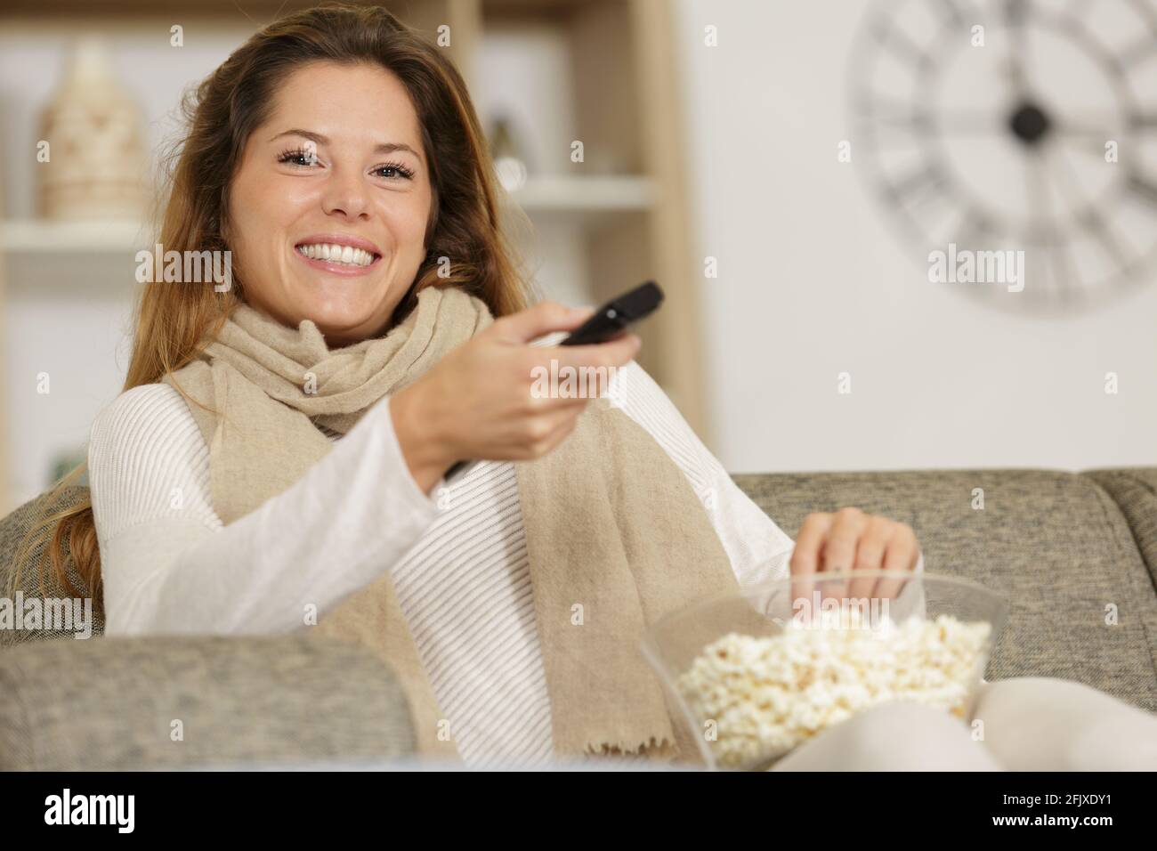 portrait of a funny young watching tv Stock Photo