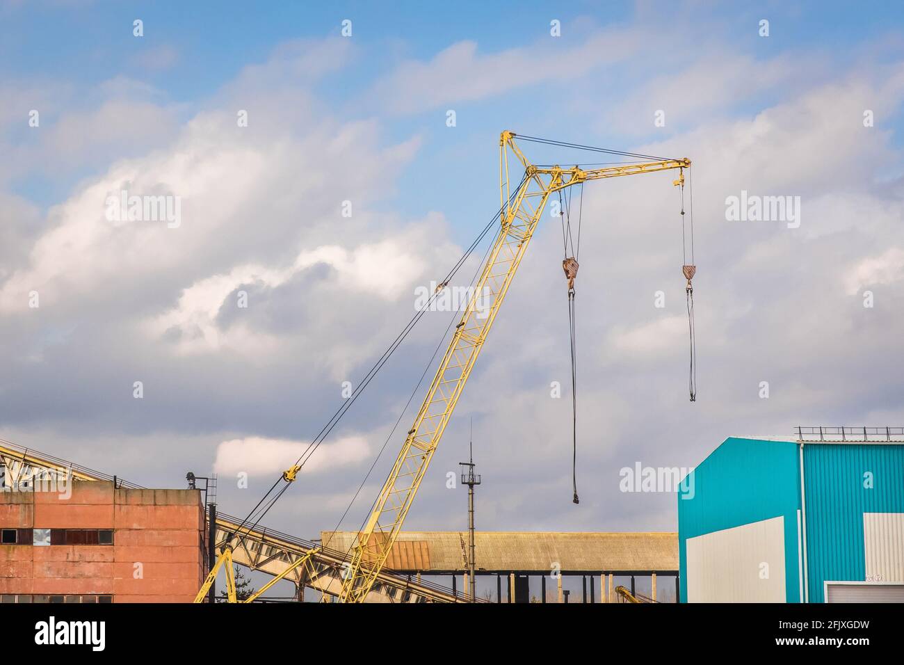 Industrial zone, construction site with auto crane work outdoor. Stock Photo