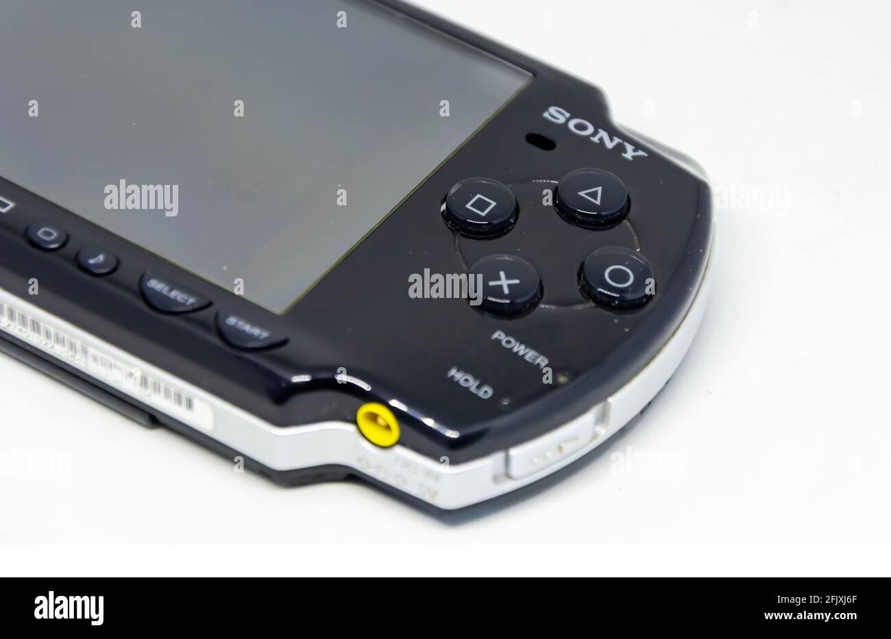 Rome, Italy, April 9th 2021: Side view of a Sony PlayStation Portable (PSP). PSP is a handheld game console developed and marketed by Sony. Mobile ent Stock Photo