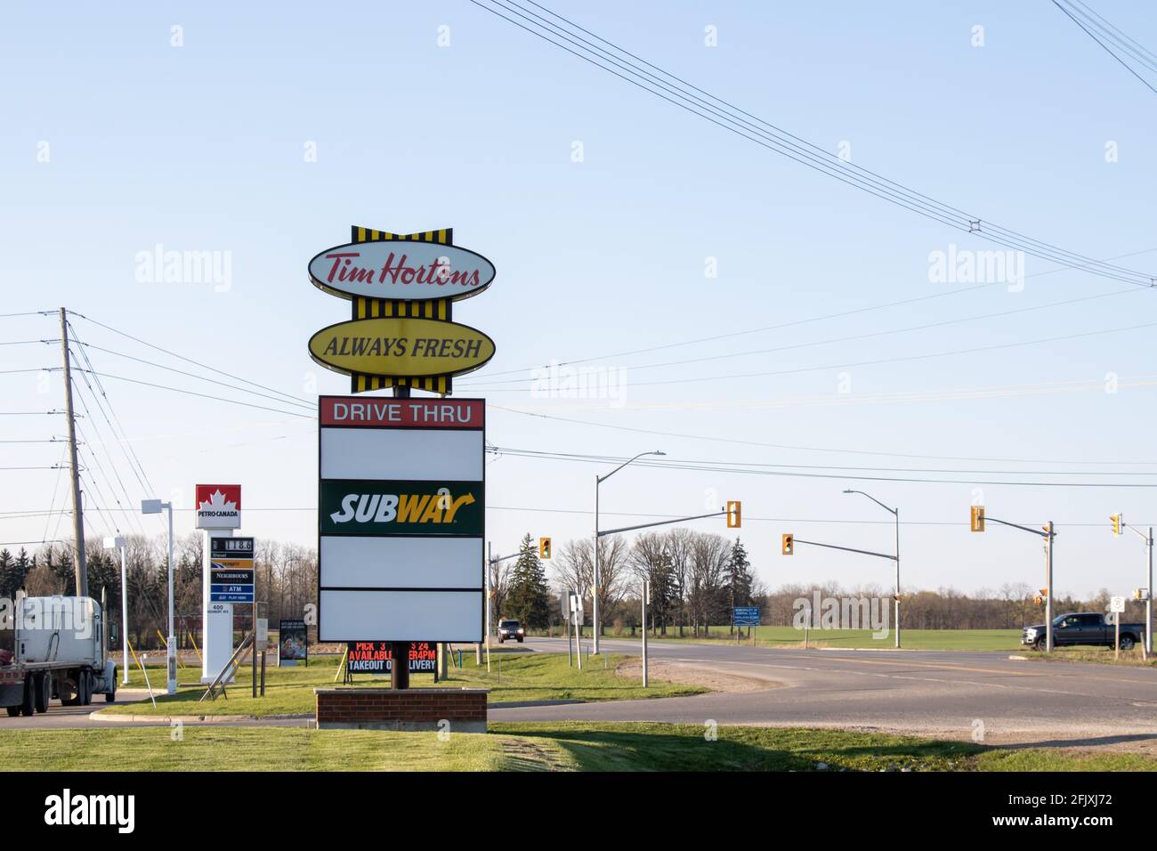 Highway rest stops signs on Highbury Avenue in St. Thomas, Ontario. Tim Hortons, Subway, Petro Canada. Stock Photo