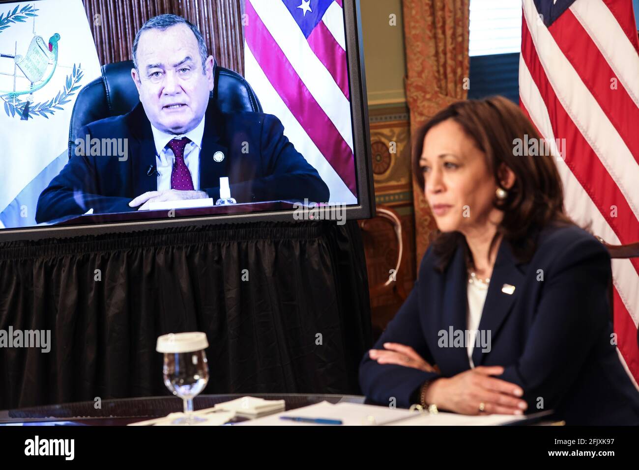 United States Vice President Kamala Harris, right, listens to President Alejandro Giammattei of Guatemala, left, during a virtual bilateral meeting in the Vice President's Ceremonial Office in the Eisenhower Executive Office Building on the White House campus, about the migration crisis on April 26, 2021, in Washington, DC. Credit: Oliver Contreras/Pool via CNP /MediaPunch Stock Photo