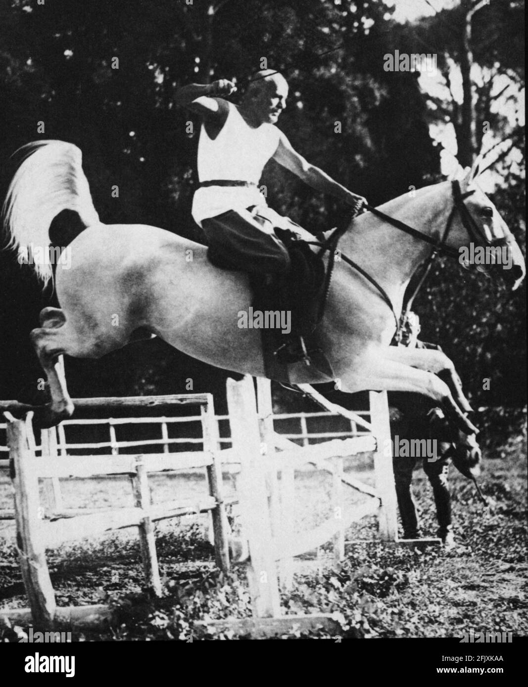 1930 's , ITALY  : The italian fascist  dictator BENITO MUSSOLINI  ride a horse  - World War 2nd - WW II - WWII - SECONDA GUERRA MONDIALE - FASCISTA - FASCIST - FASCISMO - FASCISM - cavallo - cavallerizzo - salto a ostacoli - ippica    ----  Archivio GBB Stock Photo