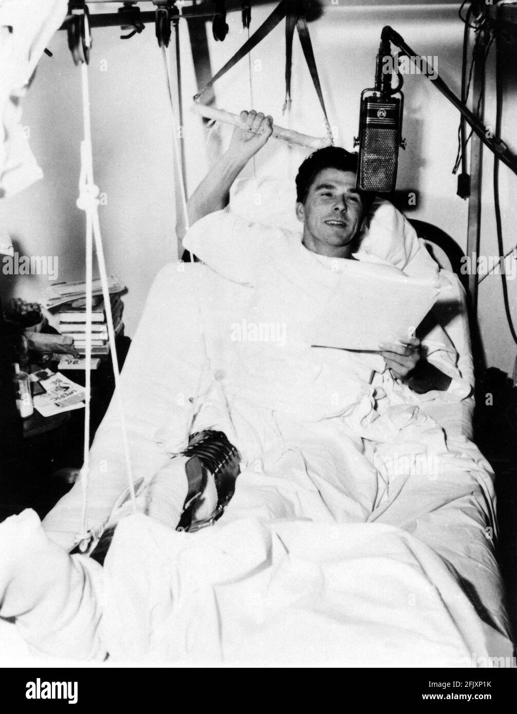 ca. , Los Angeles , The future USA President , the movie actor RONALD ( 1911 - 2004 ), during a radio show in hospital after a horse