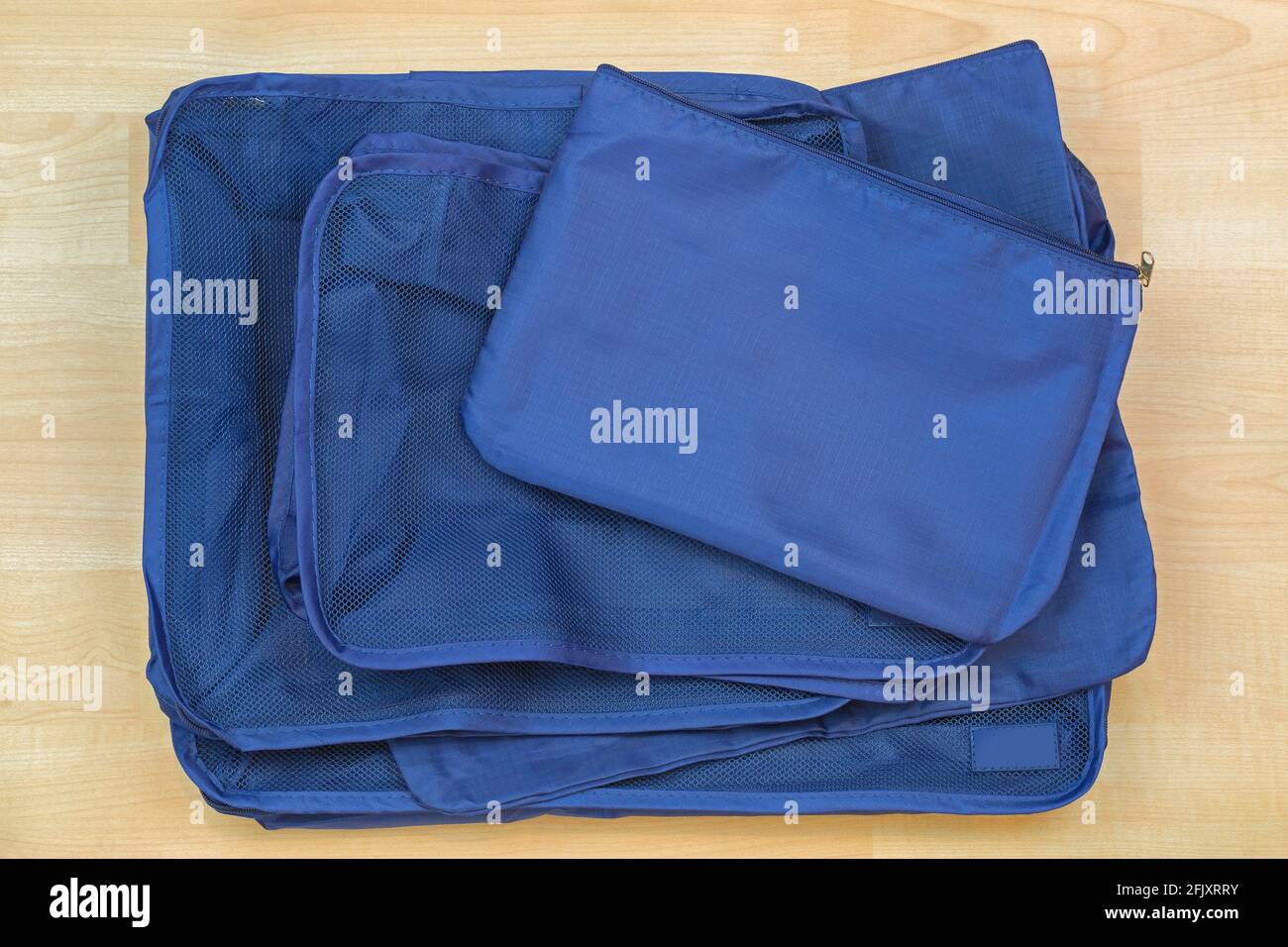 Different blue cube bags in blue color, set of travel organizer to help