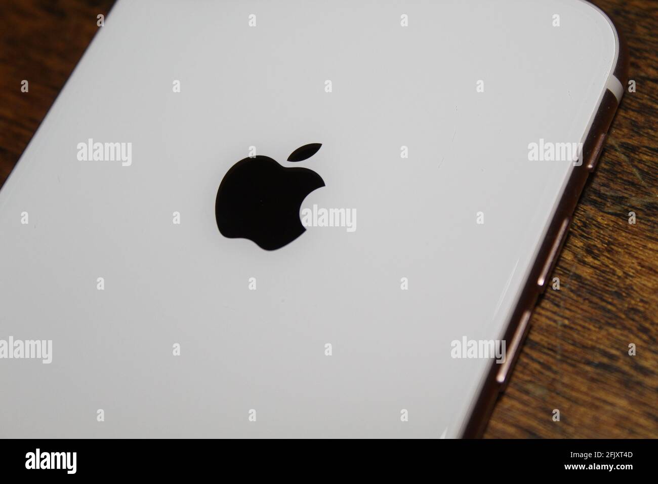Apple iPhone 8 Gold Back Glass Logo Stock Photo