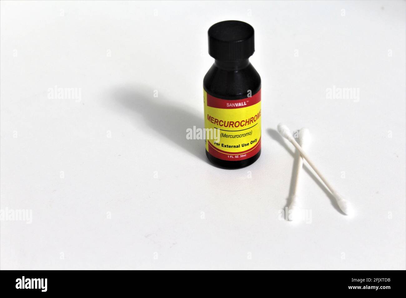 Mercurochrome medicine,  over the counter antiseptic solution for wounds. Cotton swabs. Isolated on white background Stock Photo