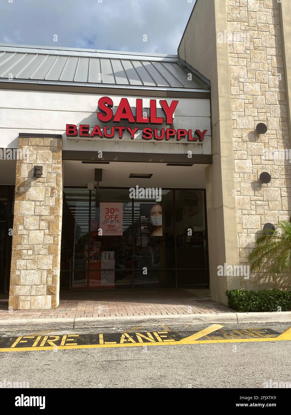 Exterior store front of Sally Beauty Supply entrance in Davie, Florida Stock Photo