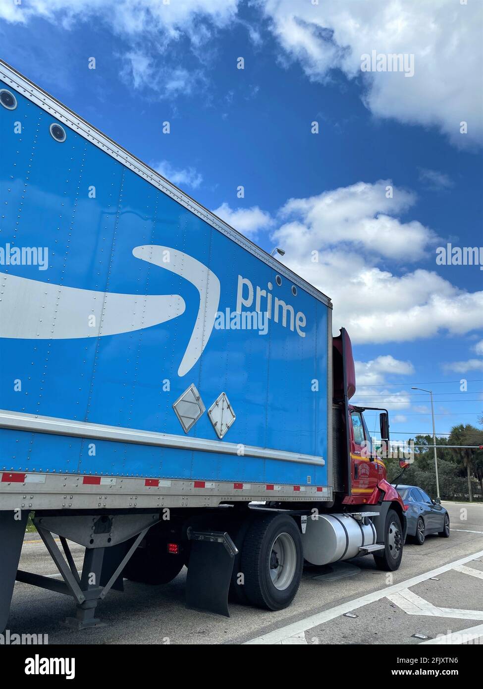 Amazon Prime logo on a delivery truck on the highway. Stock Photo