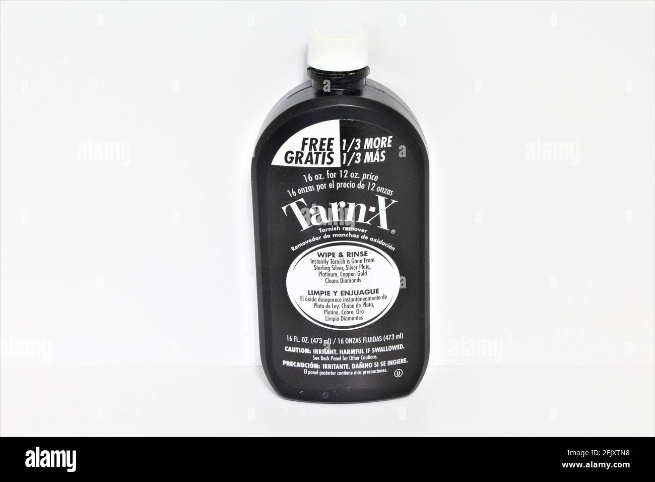 Black bottle of Tarn-X which eliminates tarnish from metals like