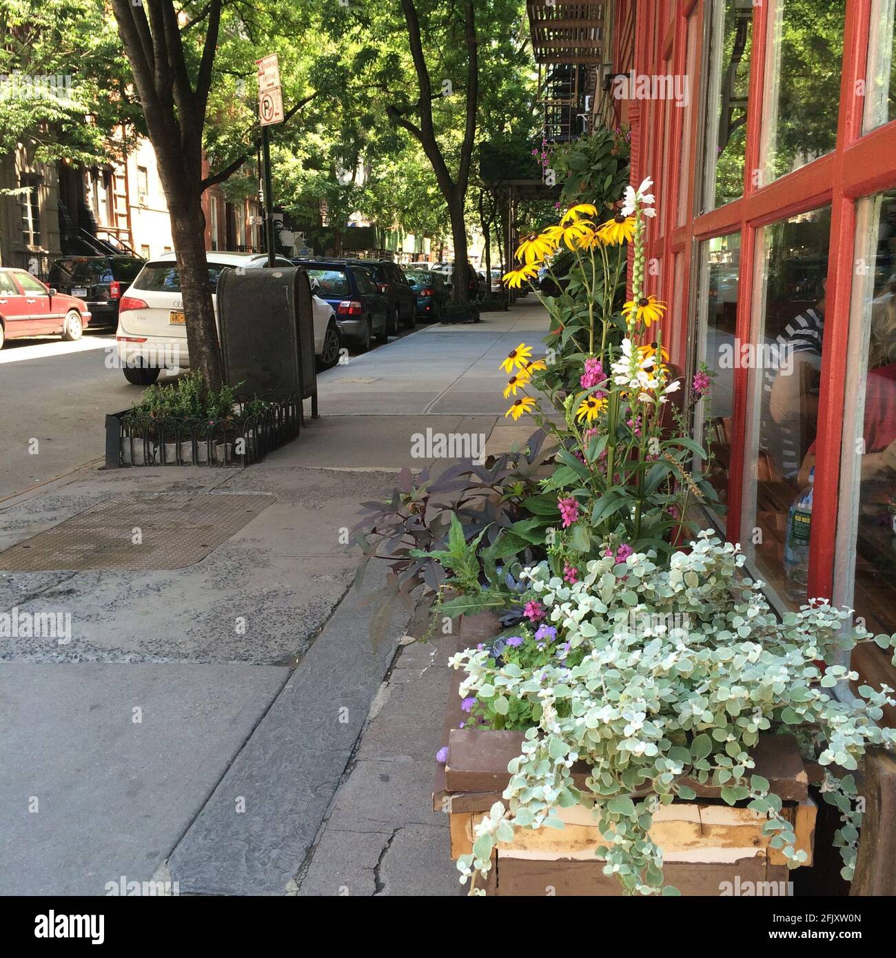 Building on the corner of Bedford Street and Grove Street in Greenwich Village, featured in FRIENDS the tv show. Flowers outside the window. Stock Photo