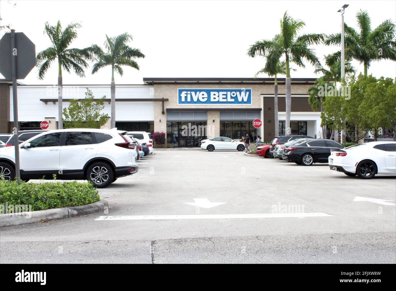 Exterior store front facade of Five below entrance. A discount sales retail store that sells items for up to no more than $5 Stock Photo