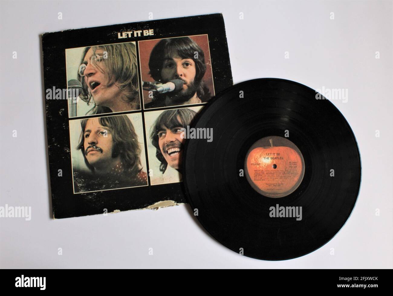 Let it Be is a record by the English rock band The Beatles. This music album is on a vinyl record LP disc. Psychedelic pop music. Stock Photo