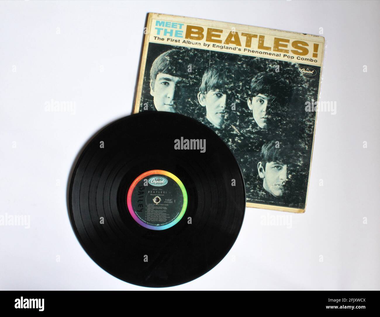 English rock band The Beatles music album on vinyl record LP Titled Meet  the Beatles! Their first American Album with song I want to hold your hand  Stock Photo - Alamy