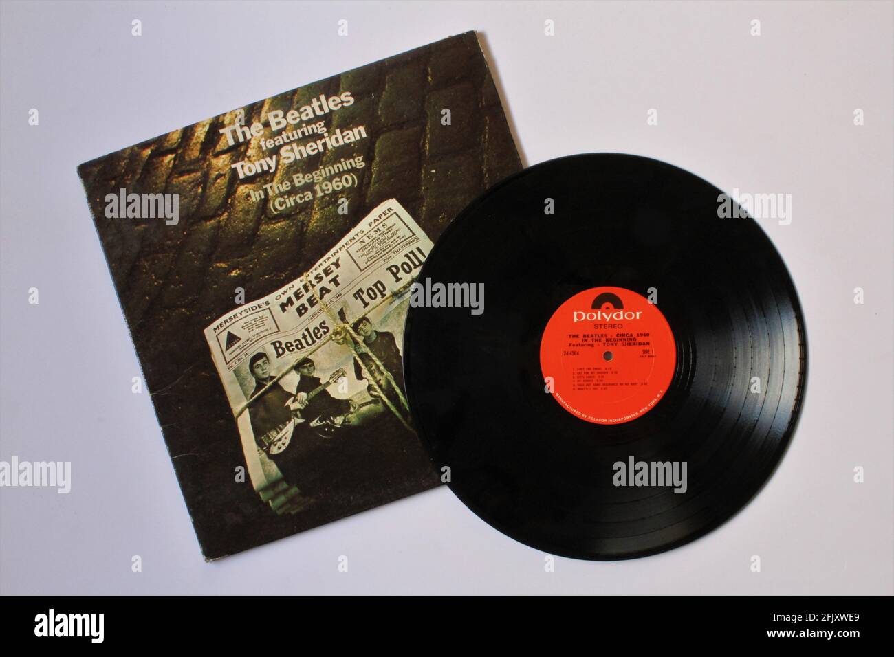 Rock and roll artist, The Beatles featuring Tony Sheridan music album on vinyl record LP disc. Titled: In the Beginning Circa 1960 Stock Photo