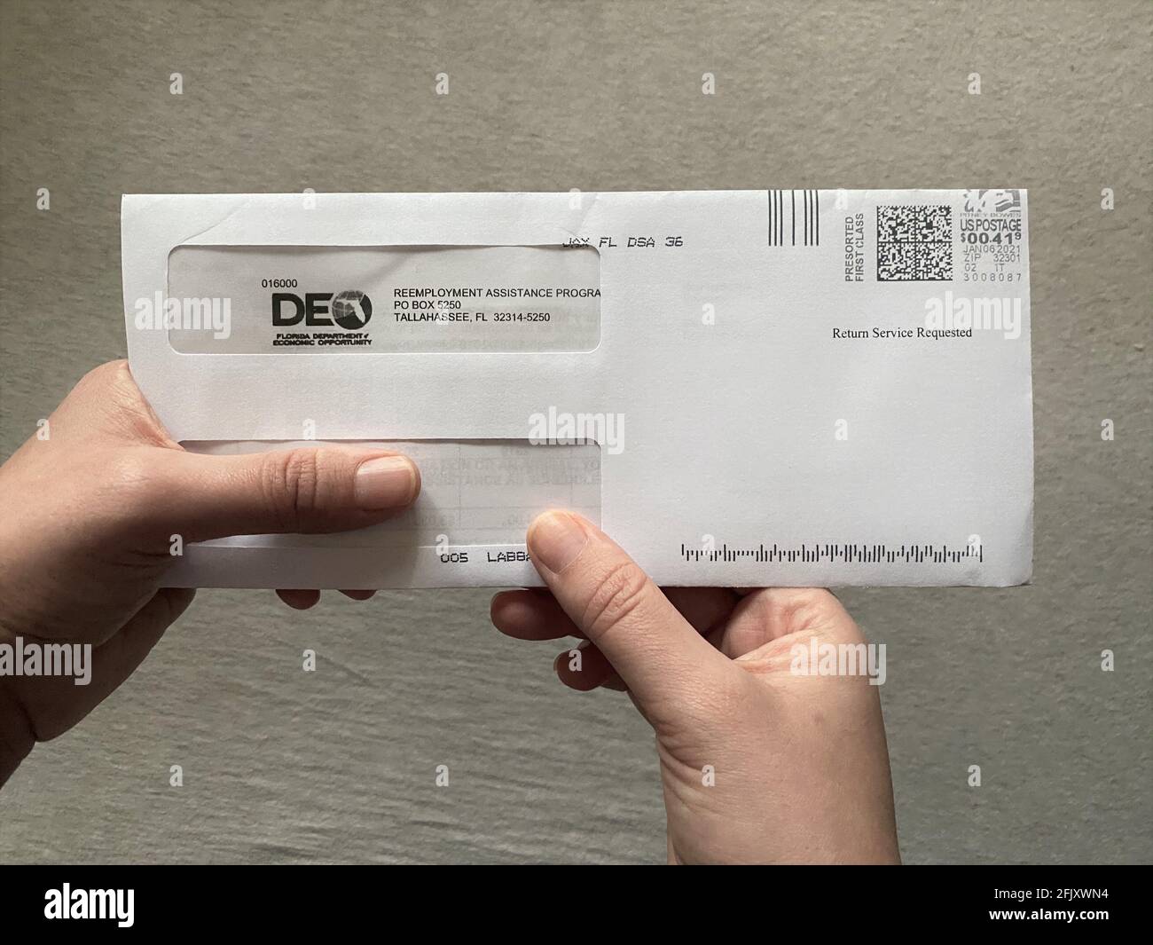 Letter in the mail arrives from the DEO, Department of Economic Opportunity, regarding unemployment benefits due to COVID-19 pandemic, Corona virus Stock Photo