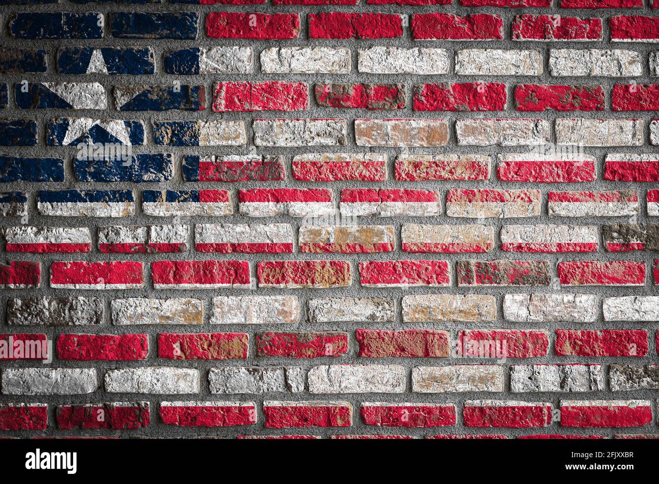 National flag of Liberia depicting in paint colors on an old brick wall ...