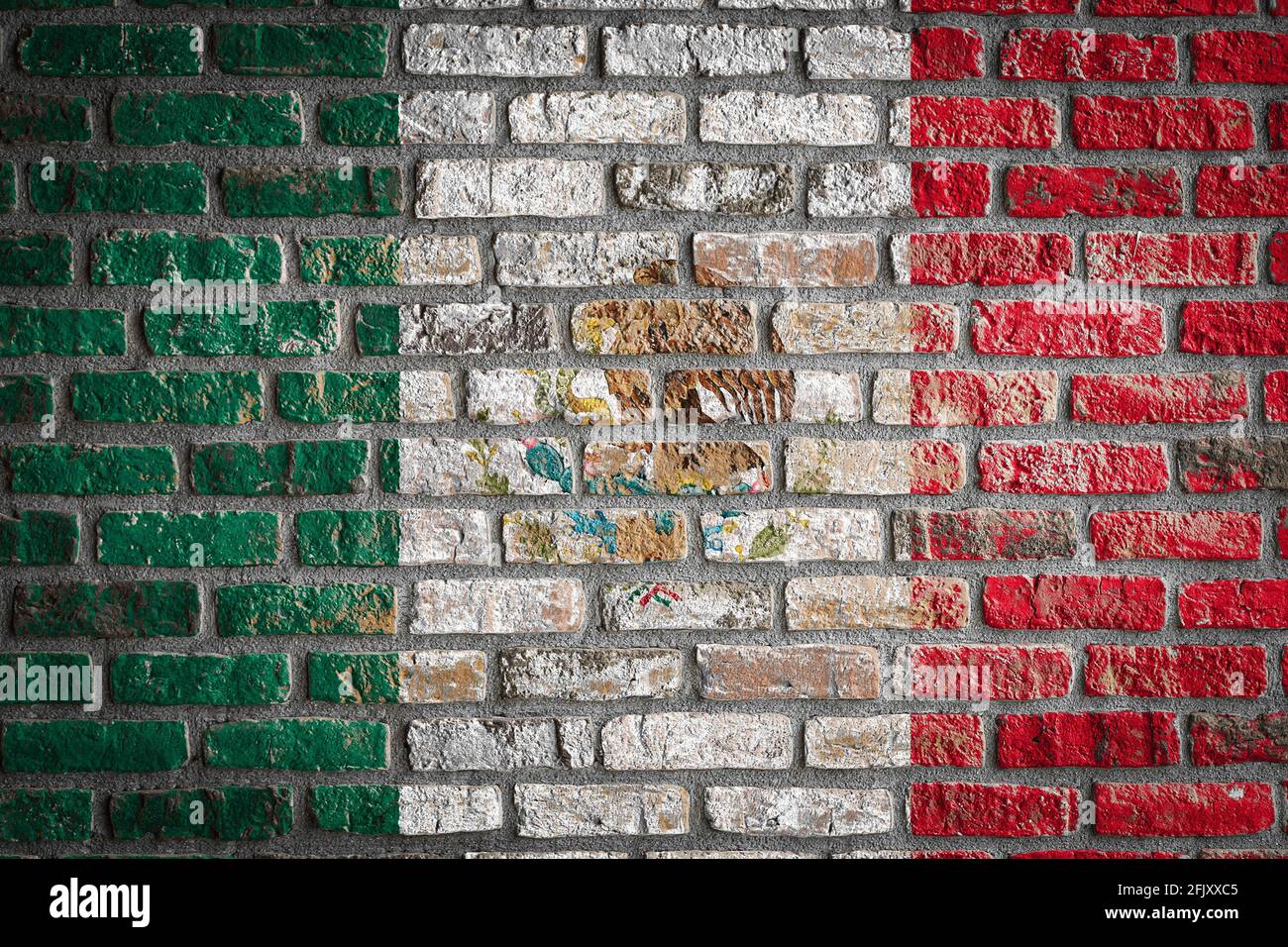 National flag of Mexico depicting in paint colors on an old brick wall ...
