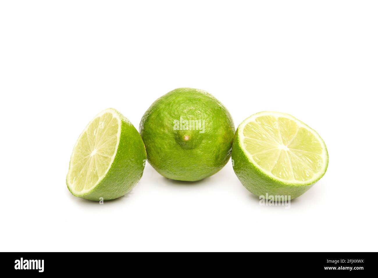 Fresh and sliced lime isolated on white background Stock Photo
