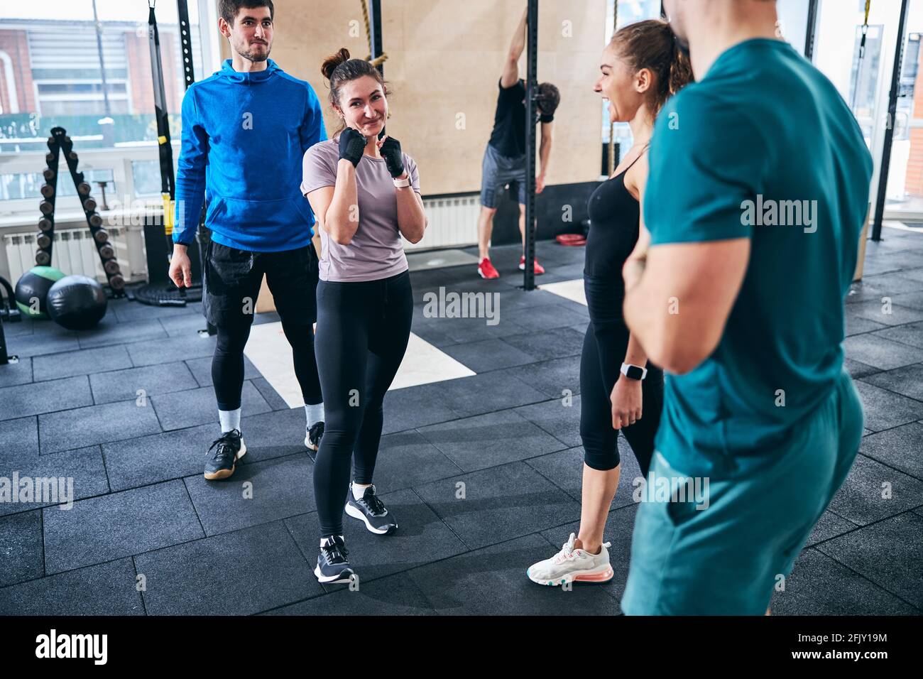 Pleased sportswoman posing for the camera at the gym Stock Photo - Alamy